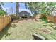 Well-maintained backyard with a deck offers space for outdoor relaxation and entertainment, complete with a fire pit at 703 S Main St, Landis, NC 28088