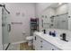 Elegant bathroom with a double vanity, glass-enclosed shower, and modern fixtures at 703 S Main St, Landis, NC 28088