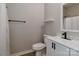 Bathroom featuring a toilet, sink, and shower/tub combination with shower curtain at 703 S Main St, Landis, NC 28088