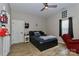 Cozy bedroom with a ceiling fan, hardwood floors, and lots of natural light at 703 S Main St, Landis, NC 28088
