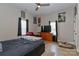 Comfortable bedroom featuring a ceiling fan, neutral walls, and a cozy sitting area at 703 S Main St, Landis, NC 28088