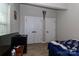 Bedroom featuring laminate wood flooring, a window for natural lighting, and closet space at 703 S Main St, Landis, NC 28088