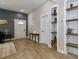 Home entryway featuring hardwood floors, neutral-toned walls, and an open view into other living spaces at 703 S Main St, Landis, NC 28088