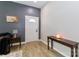 Entryway showcases modern flooring and neutral walls, featuring a console table, lamp, and a half-moon glass door at 703 S Main St, Landis, NC 28088