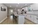Stylish kitchen with white cabinets, granite countertops, and stainless steel appliances at 703 S Main St, Landis, NC 28088