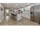 Modern kitchen featuring granite countertops, stainless appliances and barstool seating at the island at 703 S Main St, Landis, NC 28088