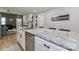 Kitchen island with granite countertops, stainless steel appliances, and barstool seating at 703 S Main St, Landis, NC 28088
