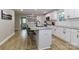 Stylish kitchen with granite countertops, white cabinets, and stainless steel appliances at 703 S Main St, Landis, NC 28088