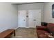 An empty room features wood-look floors, gray walls, and white doors at 703 S Main St, Landis, NC 28088