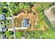 Aerial view of a home with a spacious yard, surrounded by mature trees at 7768 Lynwood Ln, Sherrills Ford, NC 28673