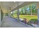 Wide back porch with ceiling fans and black metal railings overlooking the property at 7768 Lynwood Ln, Sherrills Ford, NC 28673