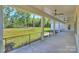 Spacious back porch with black metal railings overlooking the lush lawn at 7768 Lynwood Ln, Sherrills Ford, NC 28673