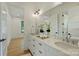 Bright bathroom featuring double vanity, and modern fixtures at 7768 Lynwood Ln, Sherrills Ford, NC 28673