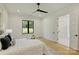 Bright bedroom with ceiling fan and backyard view at 7768 Lynwood Ln, Sherrills Ford, NC 28673
