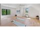 Bright bonus room with wood floors, natural light, and two yoga mats at 7768 Lynwood Ln, Sherrills Ford, NC 28673