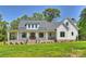 Charming two-story home featuring a welcoming front porch and manicured lawn at 7768 Lynwood Ln, Sherrills Ford, NC 28673
