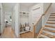 Hallway with staircase and built in bench/storage providing a welcoming entrance from the garage at 7768 Lynwood Ln, Sherrills Ford, NC 28673