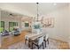 Inviting dining area flowing into a comfortable living room and a modern kitchen with a center island at 7768 Lynwood Ln, Sherrills Ford, NC 28673