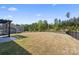 Expansive backyard featuring a pergola-covered patio and well-maintained lawn at 8901 Powder Works Dr, Huntersville, NC 28078