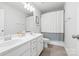A well-lit bathroom offers double sinks, a large mirror, and a shower/tub at 8901 Powder Works Dr, Huntersville, NC 28078