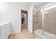 Bright primary bathroom featuring tile floors and a large glass-enclosed shower at 8901 Powder Works Dr, Huntersville, NC 28078