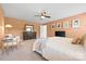 This comfortable primary bedroom features a ceiling fan, decor, and lots of space at 8901 Powder Works Dr, Huntersville, NC 28078