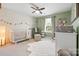 Stylized Bedroom with elegant decor and plenty of natural light from the window at 8901 Powder Works Dr, Huntersville, NC 28078