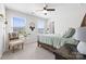 Serene bedroom with natural light, ceiling fan, and a comfortable chair at 8901 Powder Works Dr, Huntersville, NC 28078