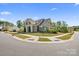 Charming exterior with manicured landscaping, stone accents, and a well-maintained lawn at 8901 Powder Works Dr, Huntersville, NC 28078