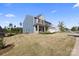 Expansive lawn surrounds this inviting two-story home, offering plenty of space for outdoor activities and relaxation at 8901 Powder Works Dr, Huntersville, NC 28078