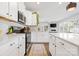 Kitchen featuring white cabinetry, stainless steel appliances, and a patterned rug at 8901 Powder Works Dr, Huntersville, NC 28078