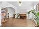 Open living room features hardwood floors, a piano, and access to other parts of the home for seamless living at 8901 Powder Works Dr, Huntersville, NC 28078
