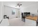 Spacious home office with wood floors, two monitors, a ceiling fan, and minimalist decor at 8901 Powder Works Dr, Huntersville, NC 28078