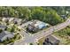 Aerial view of community pool with lounge chairs and playground near lush green trees at 8901 Powder Works Dr, Huntersville, NC 28078