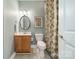 Cozy bathroom featuring a vanity, toilet, and a patterned shower curtain at 8902 Whittingham Dr, Waxhaw, NC 28173