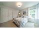Cozy bedroom with a bed, nightstand and windows at 8902 Whittingham Dr, Waxhaw, NC 28173
