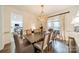 Elegant dining room with stylish chandelier and decor, perfect for entertaining at 8902 Whittingham Dr, Waxhaw, NC 28173
