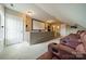 Home theater room featuring leather seating and a large projection screen at 8902 Whittingham Dr, Waxhaw, NC 28173