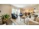 Bright living room featuring large windows with natural light and open access to the kitchen and dining areas at 8902 Whittingham Dr, Waxhaw, NC 28173