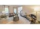 Bright living room with neutral decor, large windows, and elegant furnishings at 8902 Whittingham Dr, Waxhaw, NC 28173