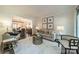 Cozy living room showcasing stylish furniture and decor, open to adjacent dining area at 8902 Whittingham Dr, Waxhaw, NC 28173