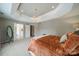 Spacious main bedroom with tray ceilings and a view to the ensuite bath at 8902 Whittingham Dr, Waxhaw, NC 28173
