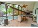 Screened porch with ceiling fans, patio heater, and comfortable seating overlooking the pool at 8902 Whittingham Dr, Waxhaw, NC 28173