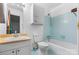 Retro bathroom featuring a blue tile and vintage fixtures at 8903 Larchmont Cir, Charlotte, NC 28214