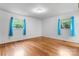Bedroom features hardwood floors, natural light, and a serene ambiance at 8903 Larchmont Cir, Charlotte, NC 28214