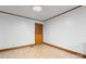 Spacious bedroom featuring neutral walls, tiled floors, and wood trim at 8903 Larchmont Cir, Charlotte, NC 28214