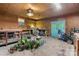 Spacious garage area features wood paneled walls, work tables, and a blue entry door at 8903 Larchmont Cir, Charlotte, NC 28214