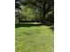 Expansive backyard with lush greenery and mature trees providing shade at 918 Carmel Dr, Gastonia, NC 28056