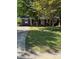 Traditional brick house with a covered front porch and well-maintained lawn at 918 Carmel Dr, Gastonia, NC 28056