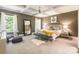Spacious bedroom boasts tray ceilings, soft carpet, and large windows allowing natural light at 924 Forbes Rd, Fort Mill, SC 29707